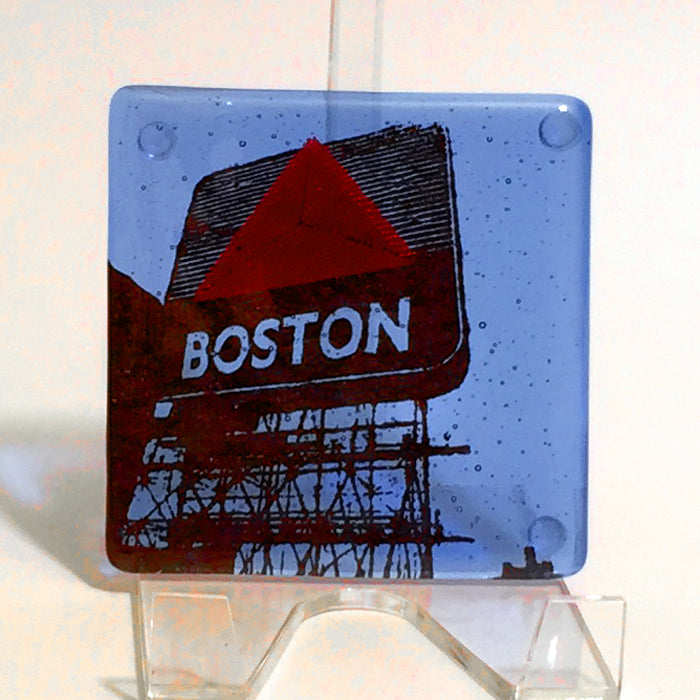 a glass block with a picture of a boston sign on it