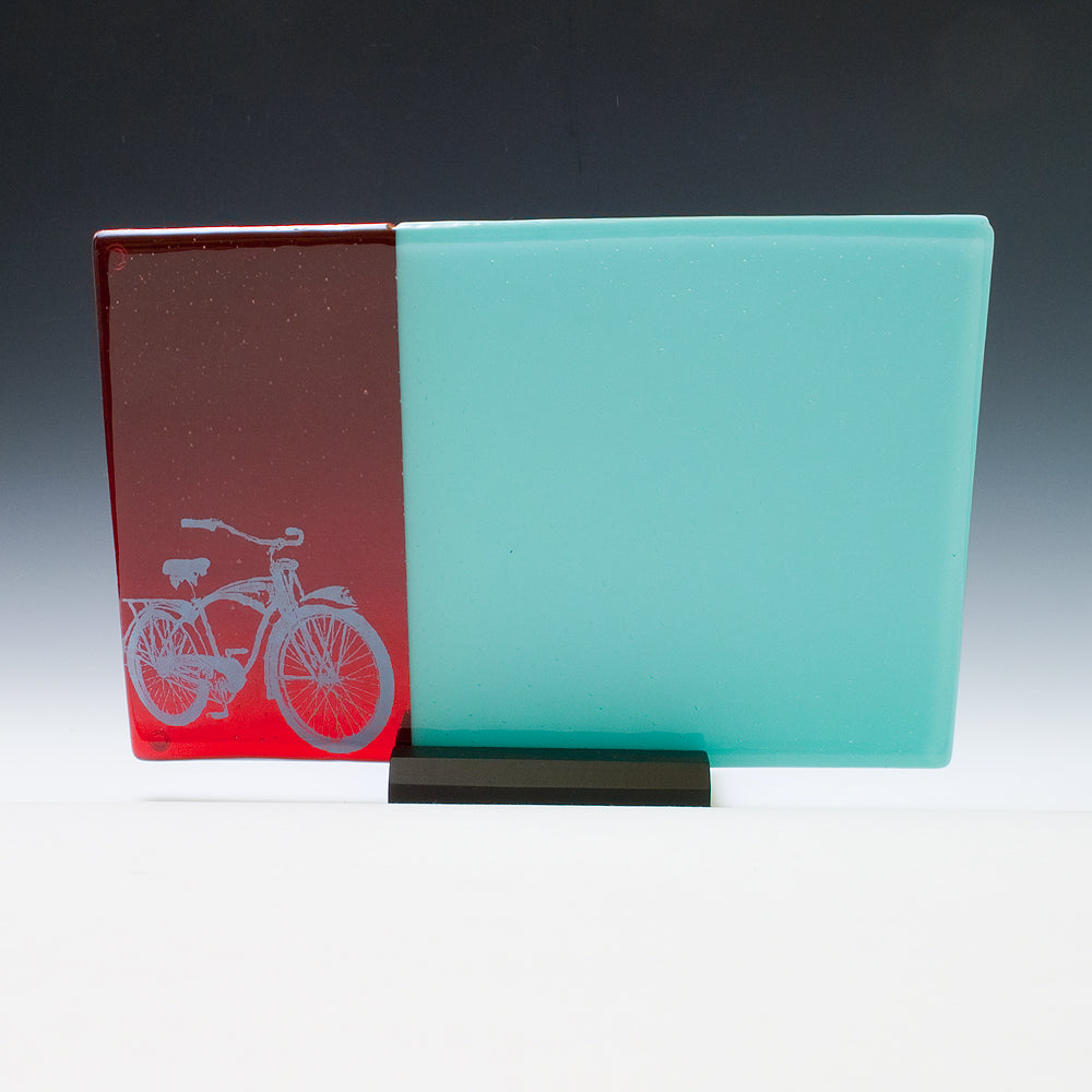 a glass block with a picture of a bicycle on it