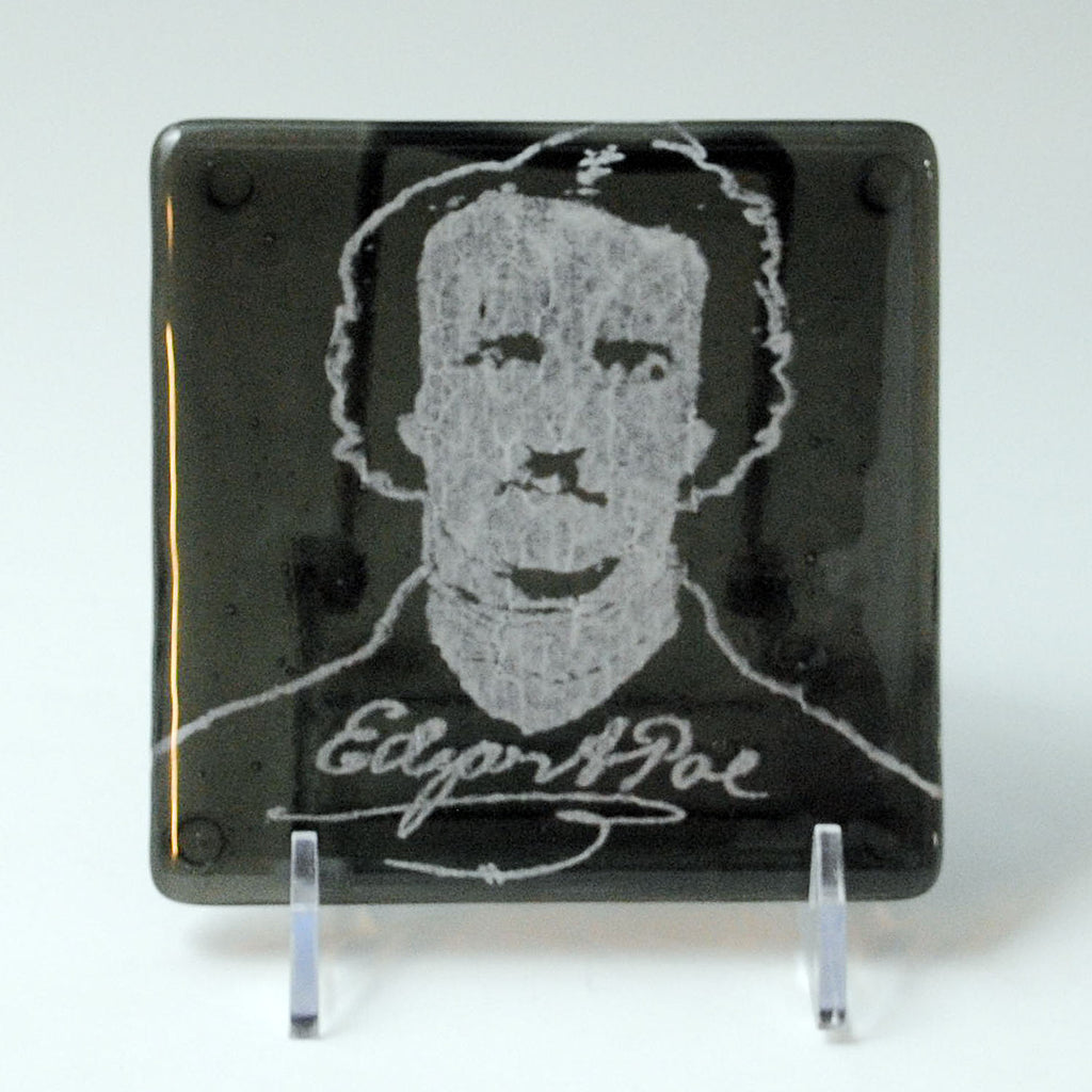 a glass plaque with a picture of edgar poe on it