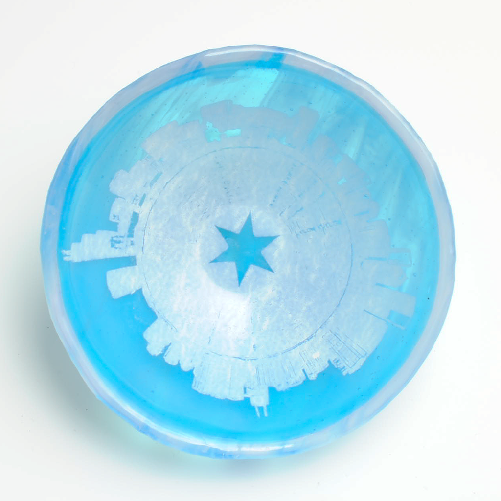 a blue and white frisbee with a star on it