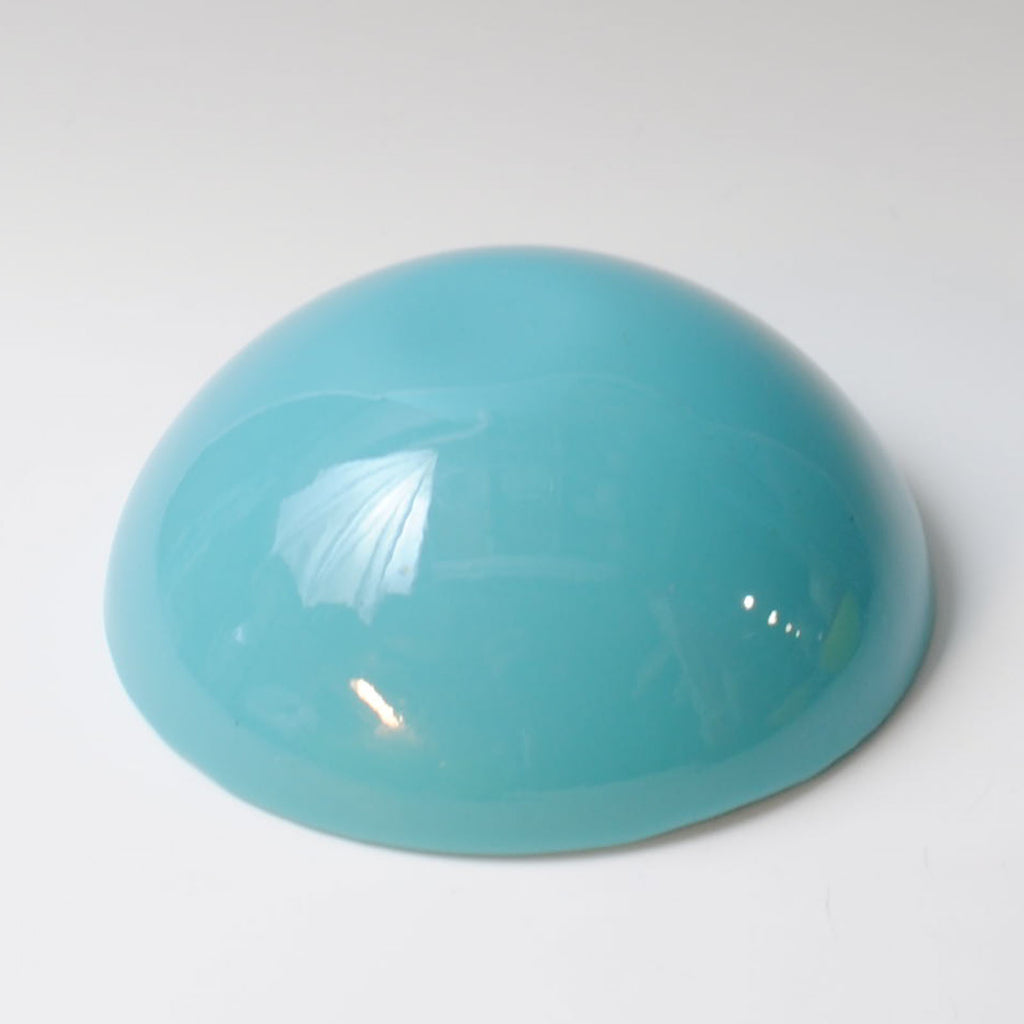 a blue object sitting on top of a white table