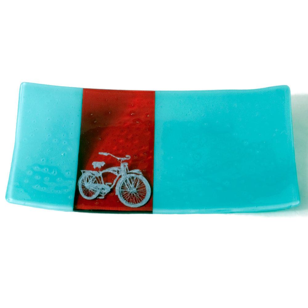 a glass plate with a picture of a bike on it