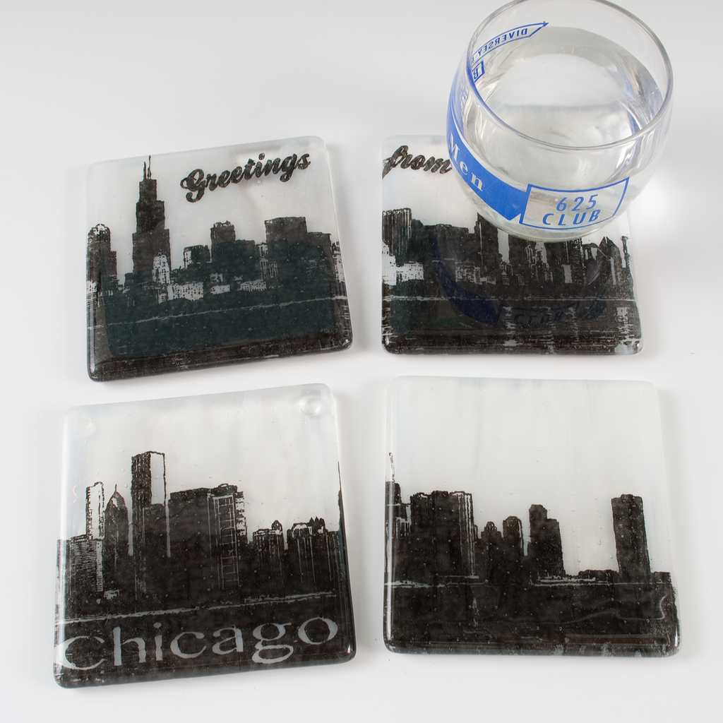 three coasters with chicago skyline etched on them