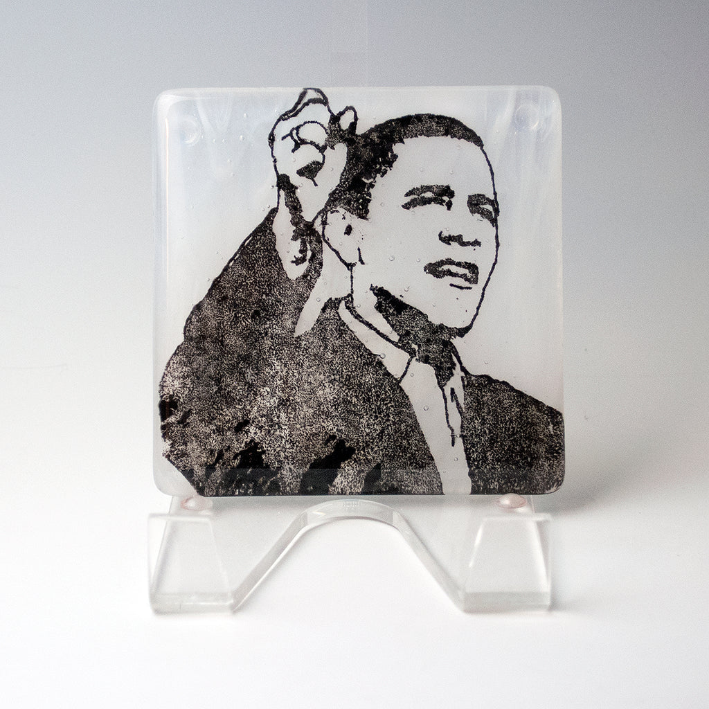 a glass block with a picture of a man in a suit