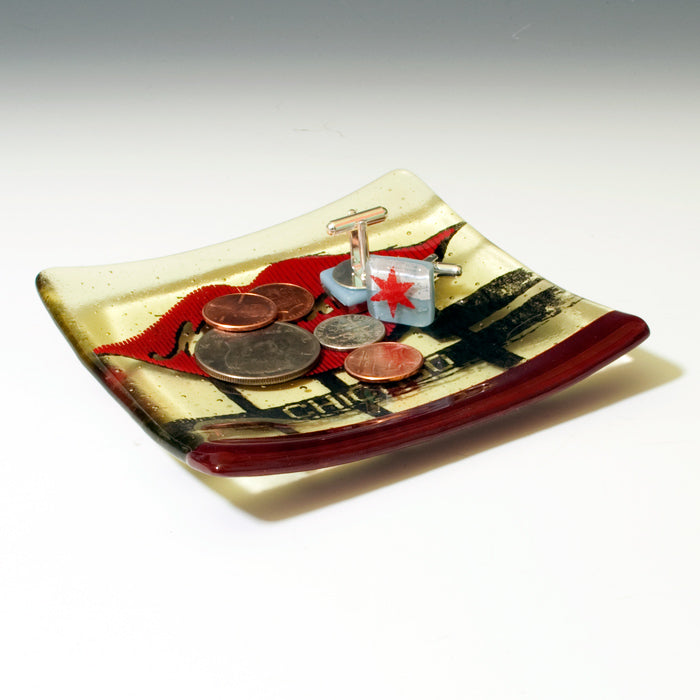 a small plate with some coins on it