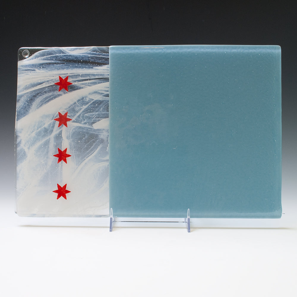 a glass block with red stars on it