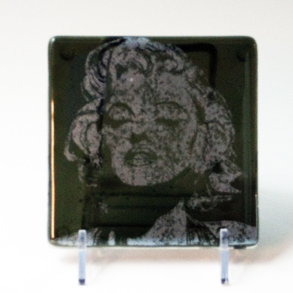 a picture of a face on a glass plate