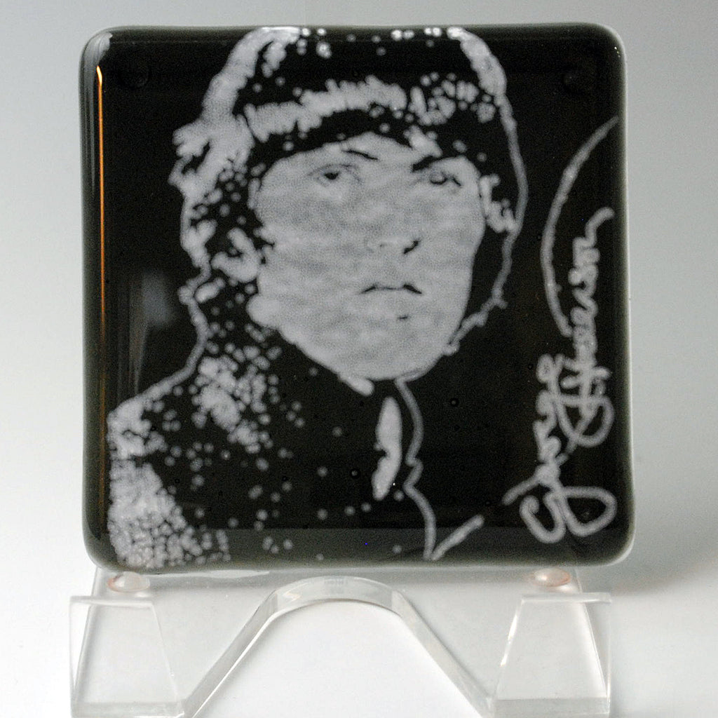 a black and white picture of a person on a glass stand