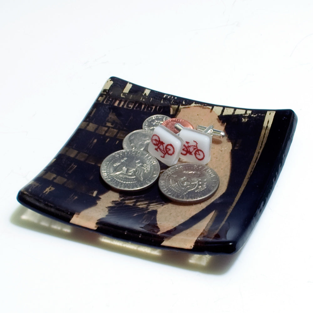 a couple of coins sitting on top of a plate