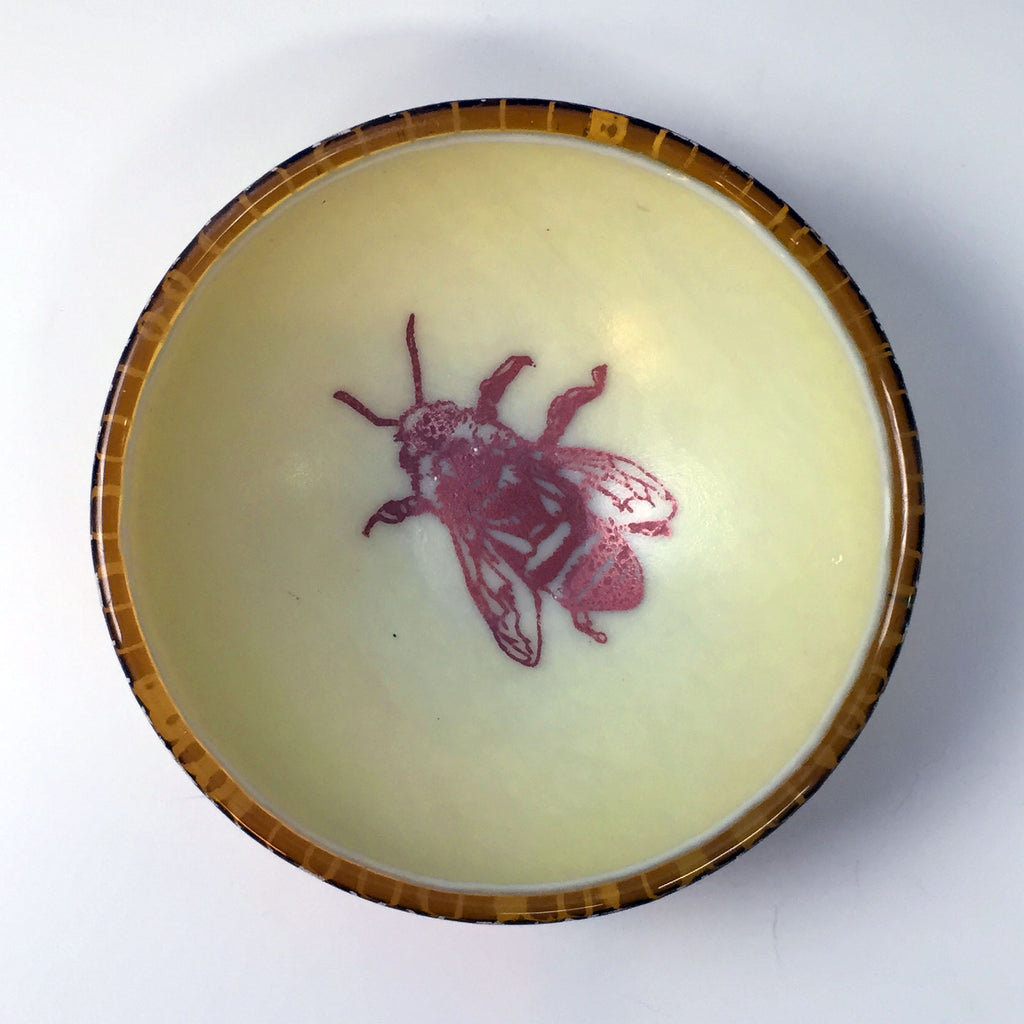 a bowl with a picture of a bee on it