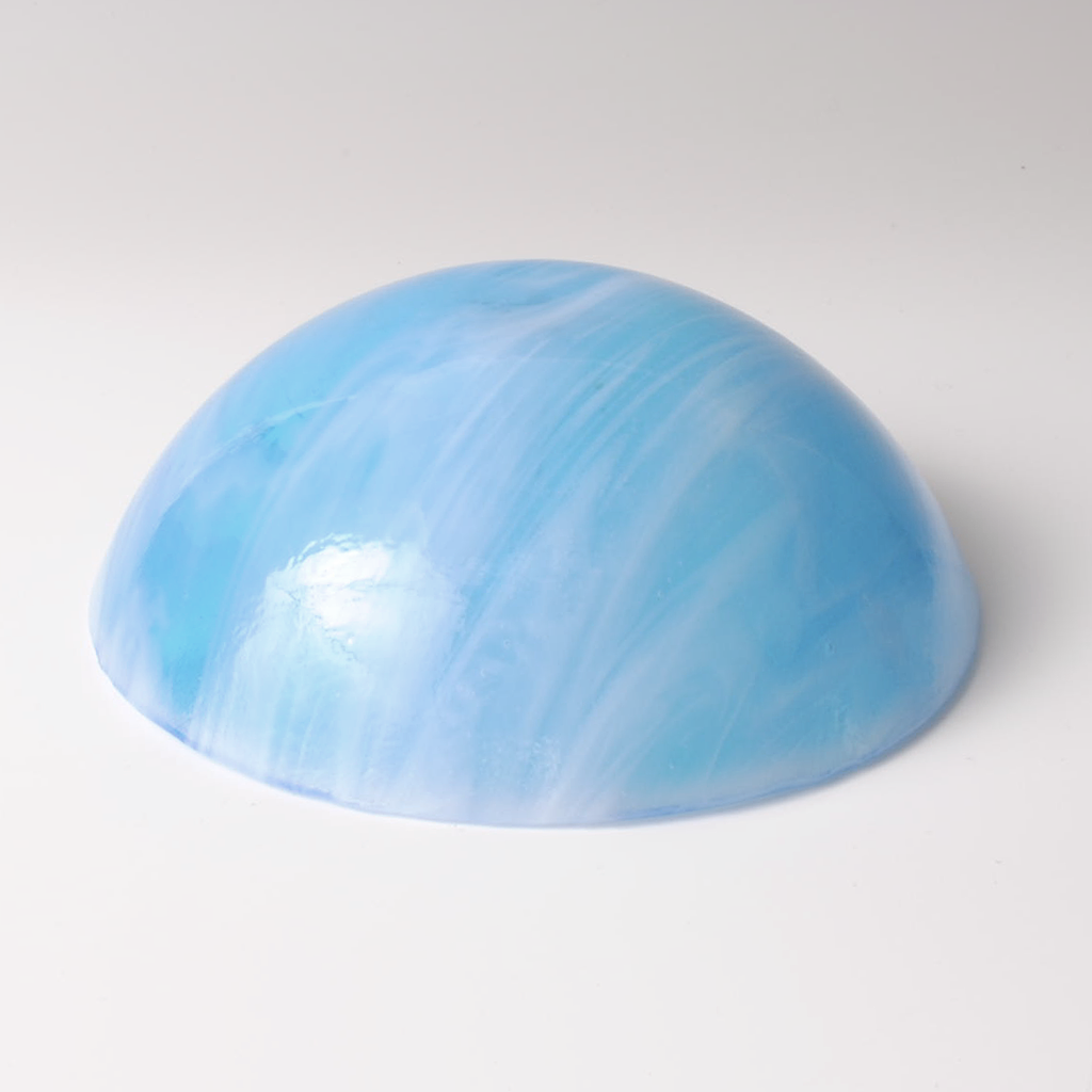 a light blue object sitting on top of a white table