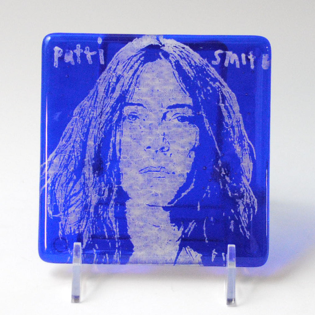 a blue plate with a picture of a woman on it