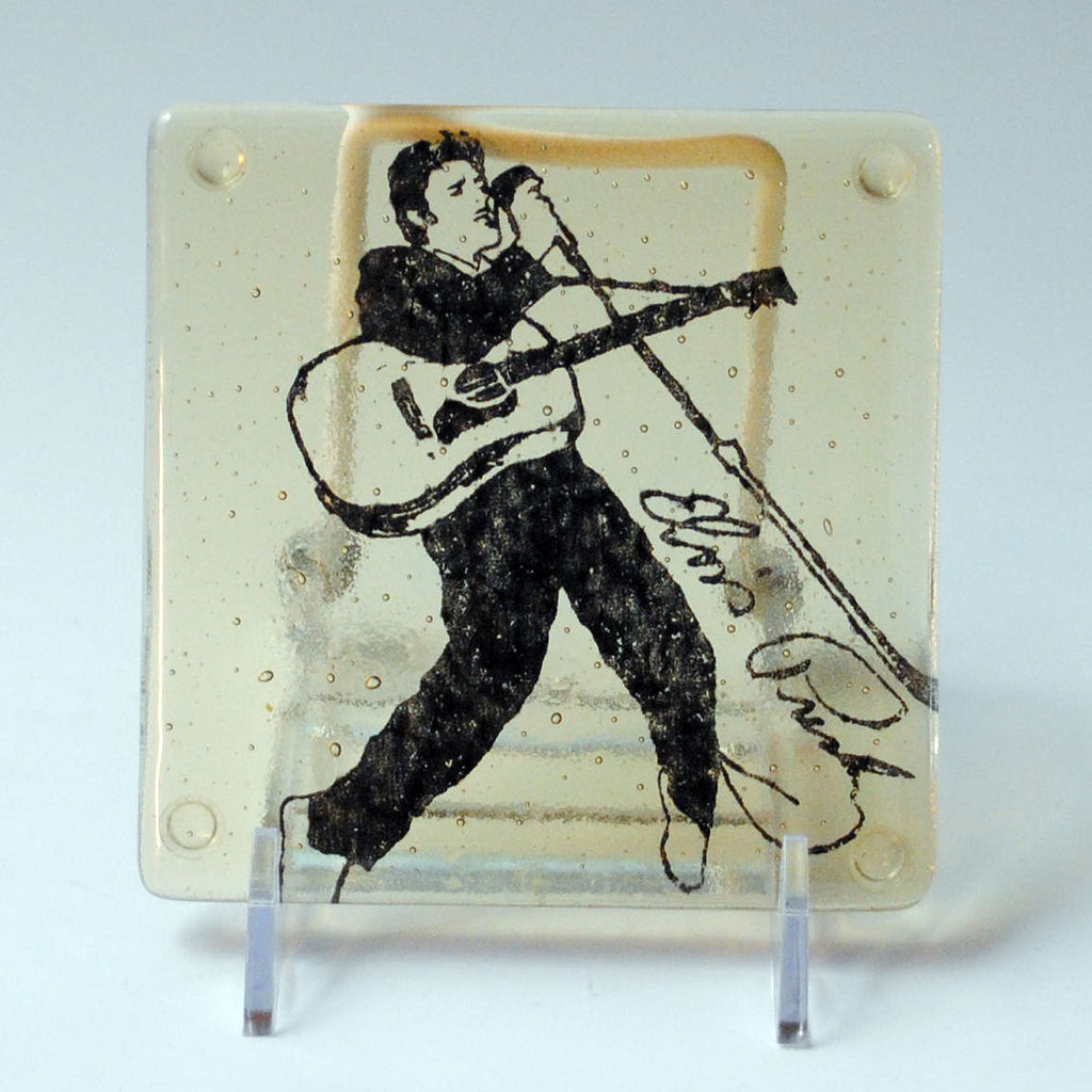 a glass picture of a man playing a guitar