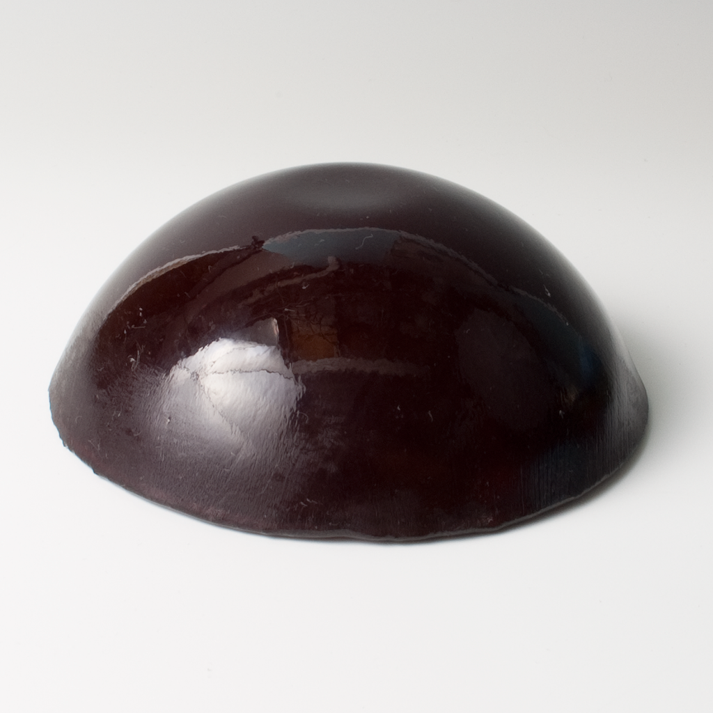 a brown object sitting on top of a white table