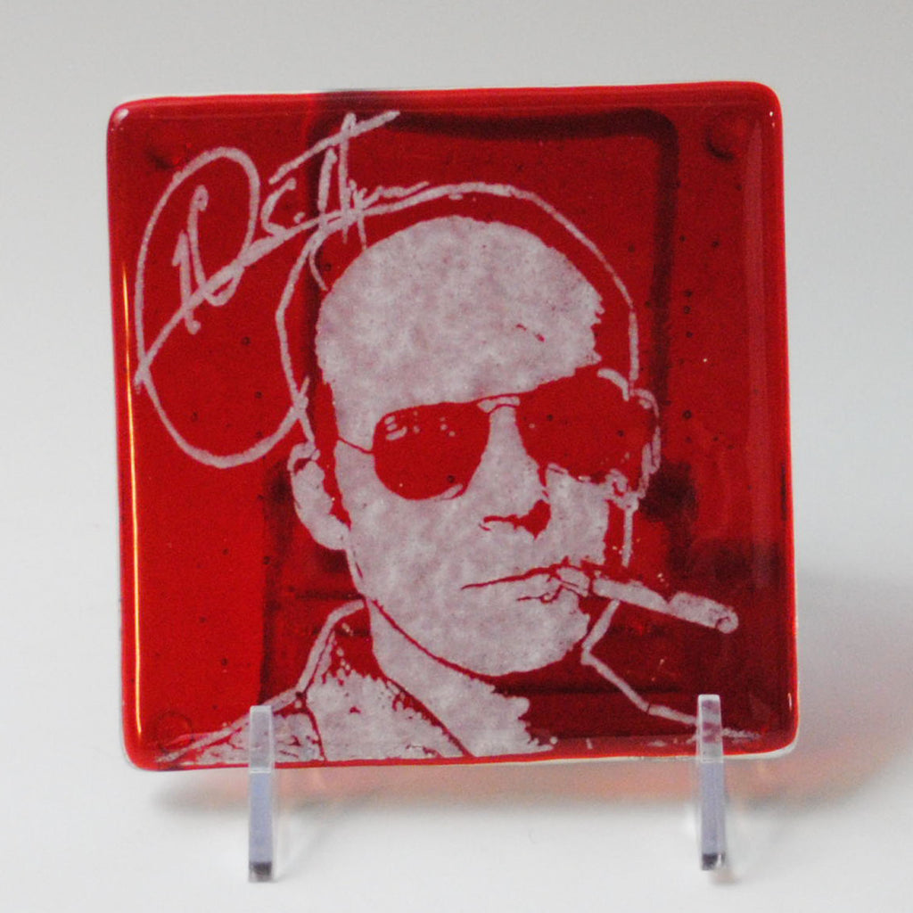 a glass plate with a picture of a man smoking a cigarette